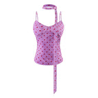 S / Purple background with polka dots