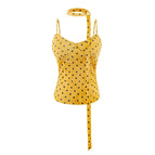 S / Yellow background with polka dots