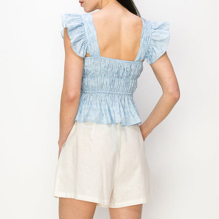 Flounced cap sleeves and hem floral print top
